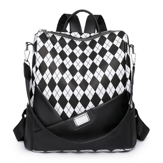 Unisex Rucksack mit auffälligem Harlekinmuster 0
