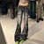 Denim-Hose mit niedriger Taille und Blumendruck